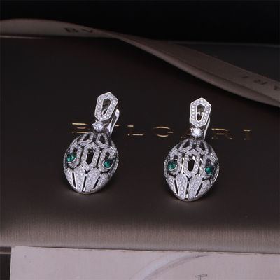 Qualità Gli orecchini di lusso di Serpenti di marca dell'oro nell'insieme dell'oro bianco 18K con Emerald Eyes e con i diamanti del pavé serpeggiano la testa fabbrica